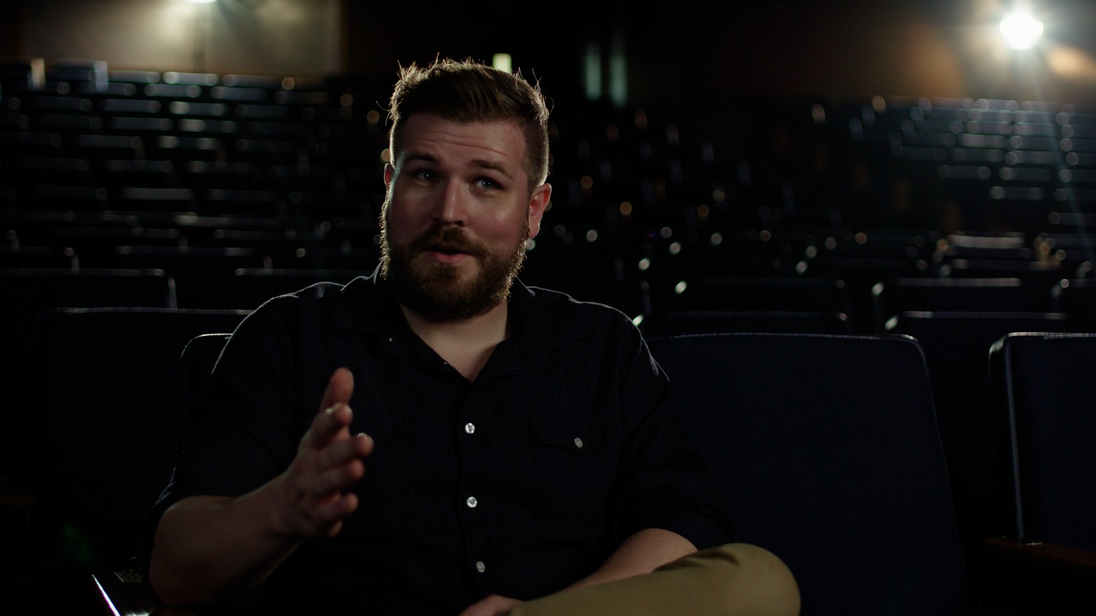 Interview in a dark theater without a look, straight conversion